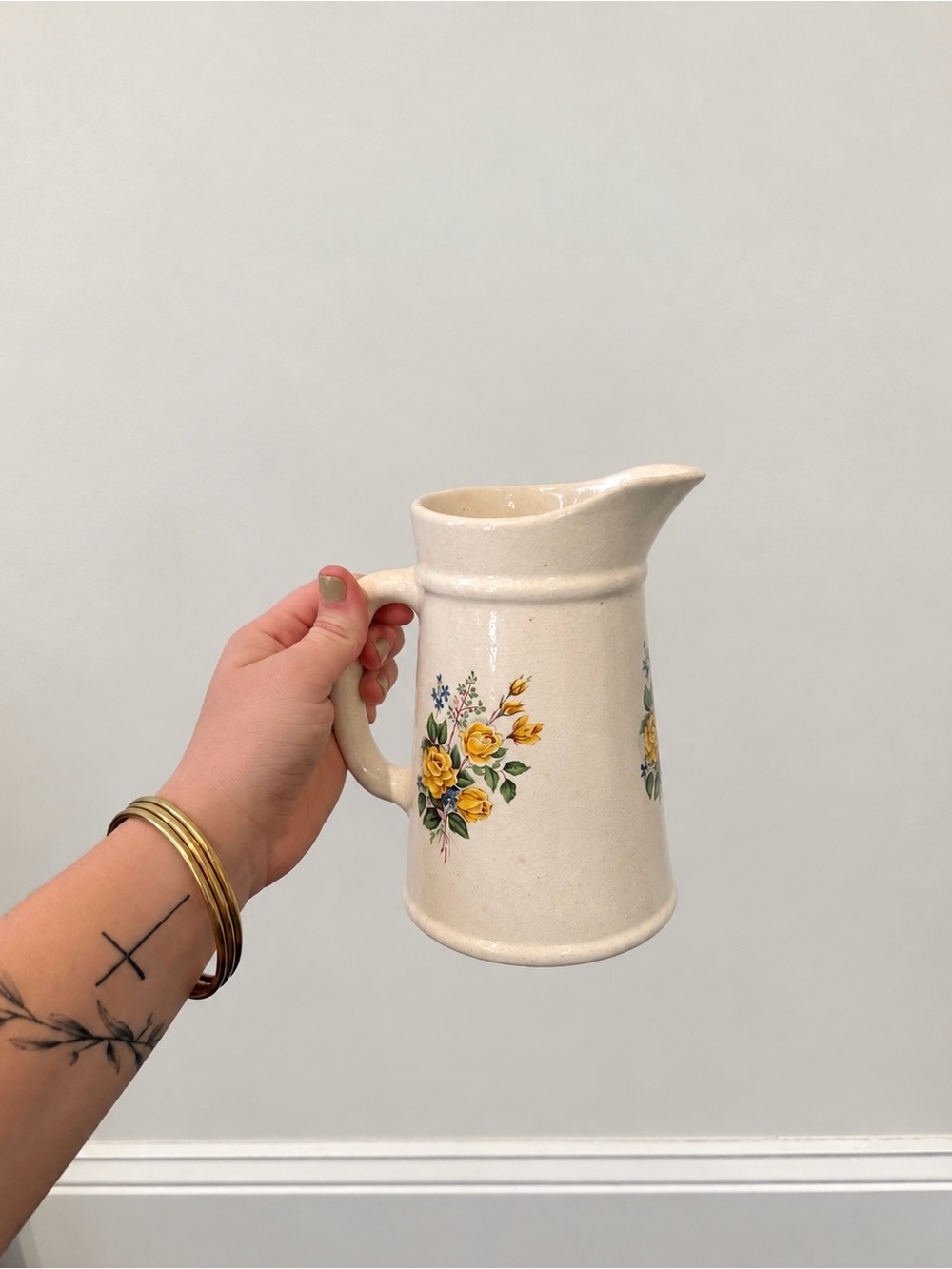 Cream Ceramic Pitcher with Yellow Floral Design